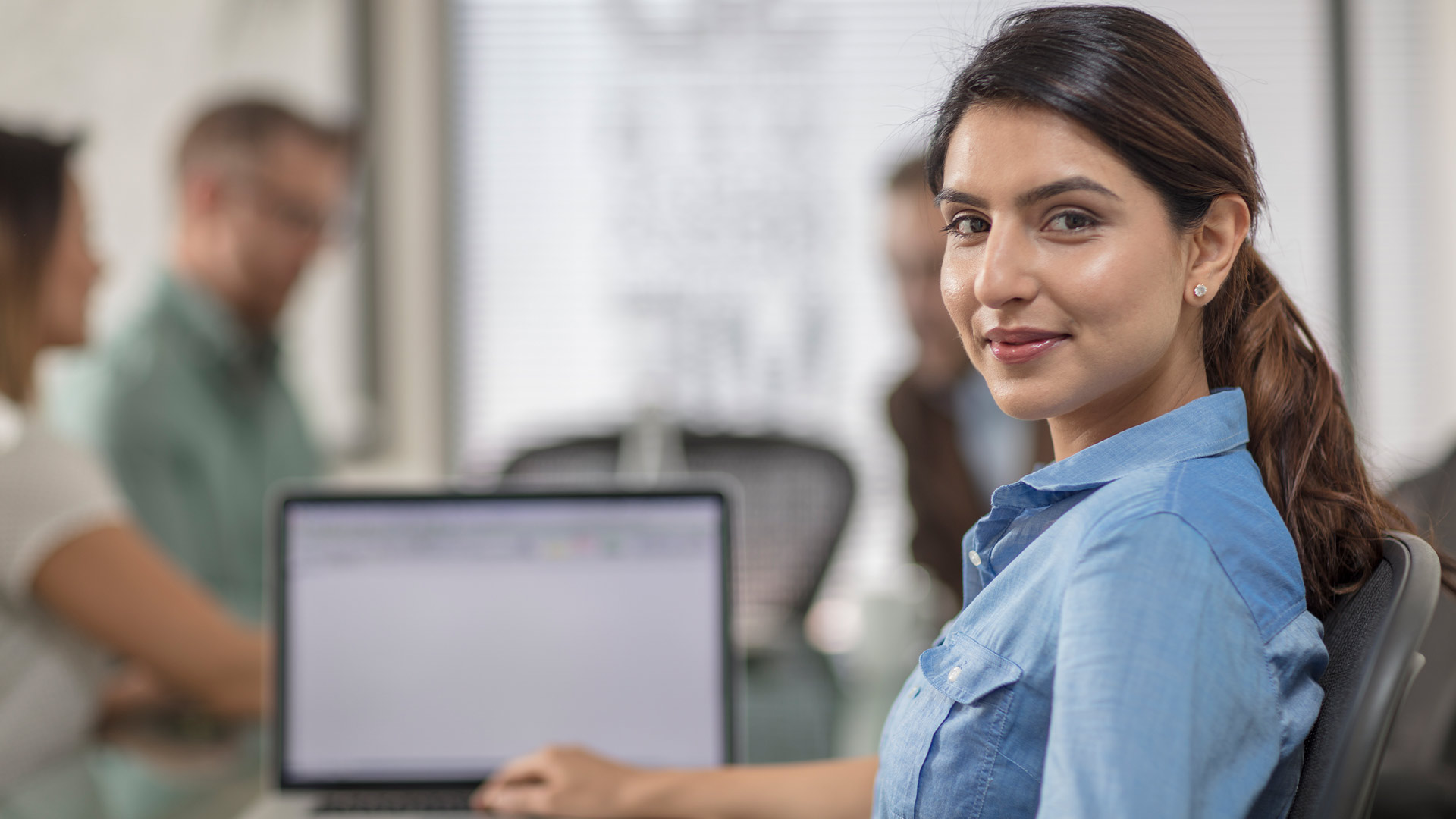 girl with laptop in office