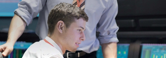 Two men reviewing data on the computer screen, energy managment