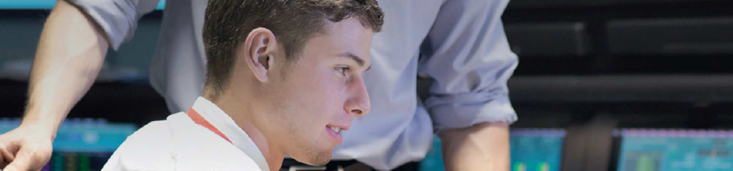 Two men reviewing data on the computer screen, energy managment